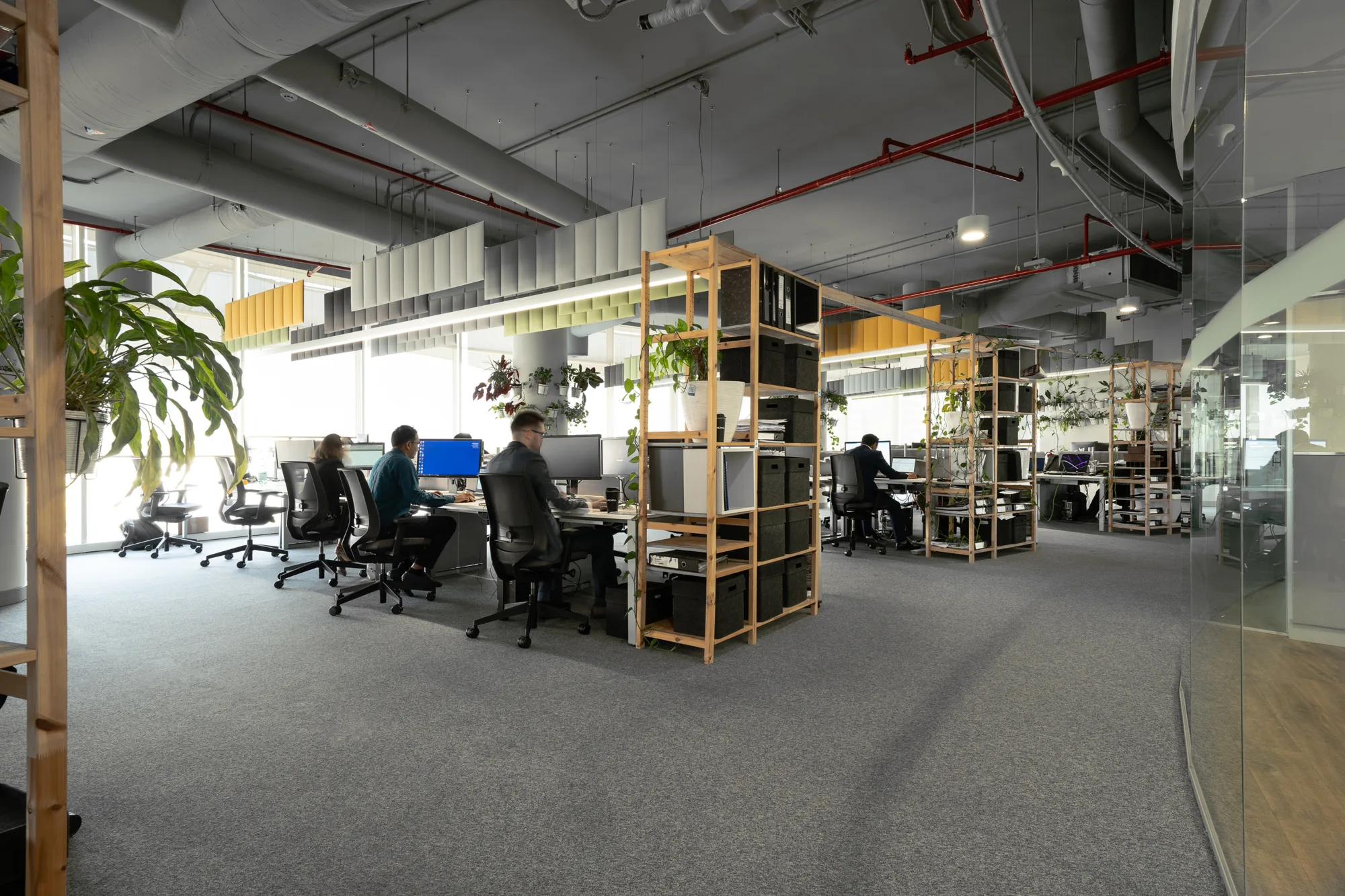 Cundall Qatar office workstations with people working